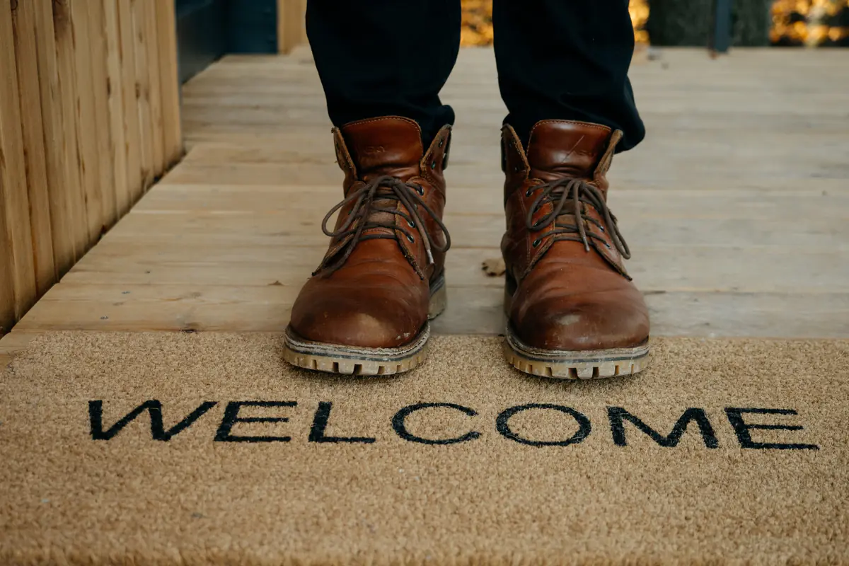 Shoes on a Welcome doormat