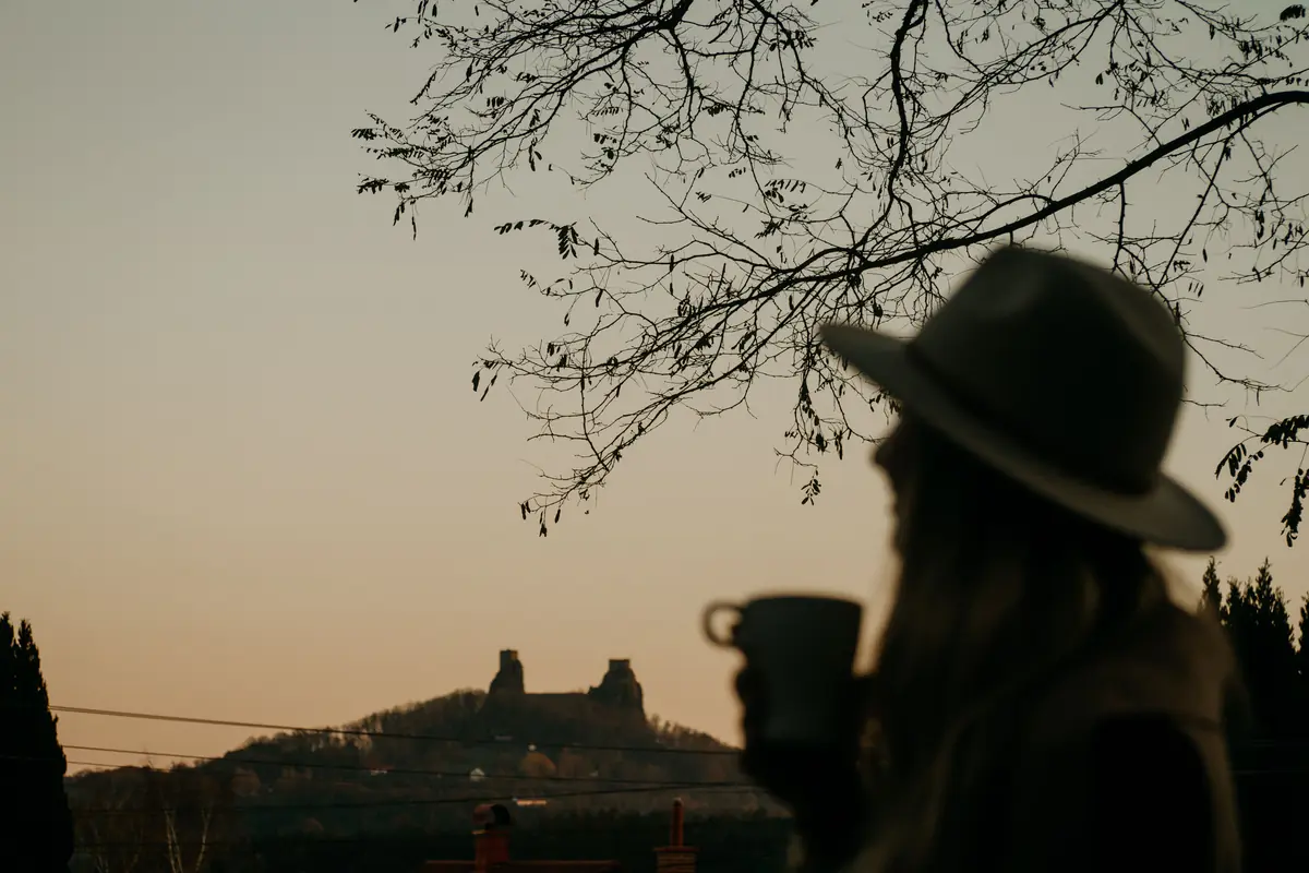 A silhouette with a mug at sunrise