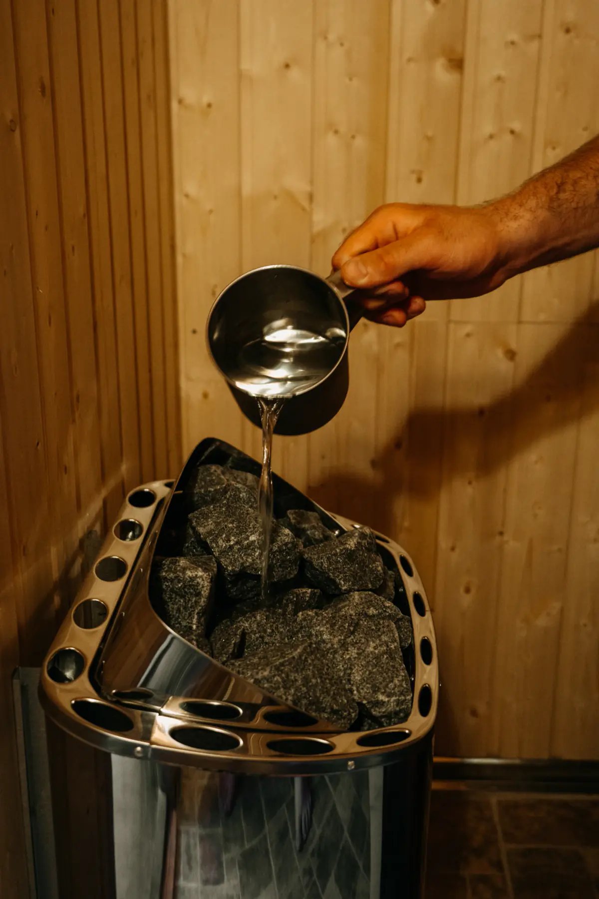 Pouring water on the sauna stove